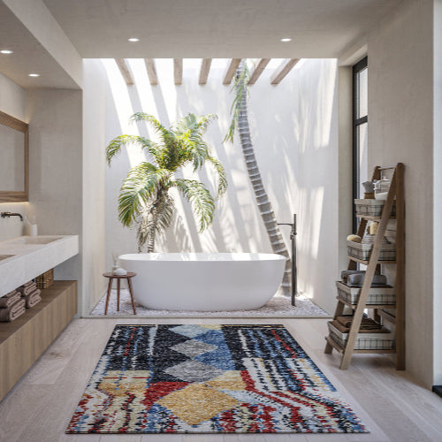 A stunning bright bathroom with a colourful Tufenkian carpet.