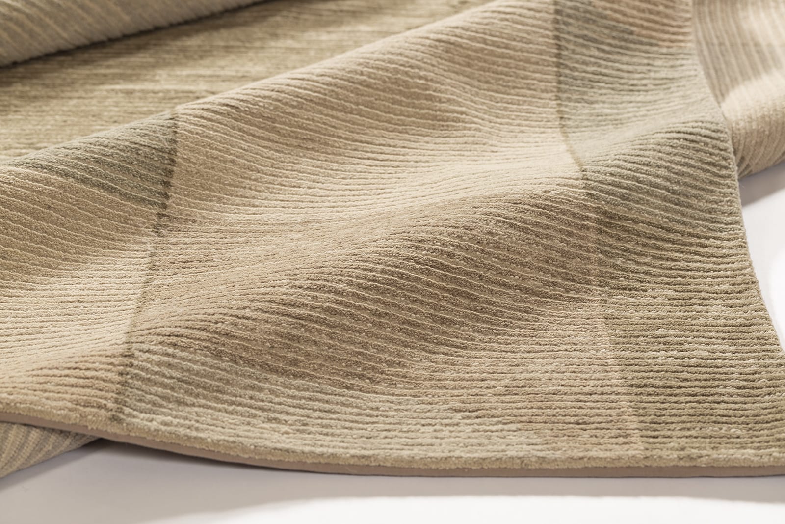 detail image of Cosmos Beige hand knotted area rug design by Tufenkian