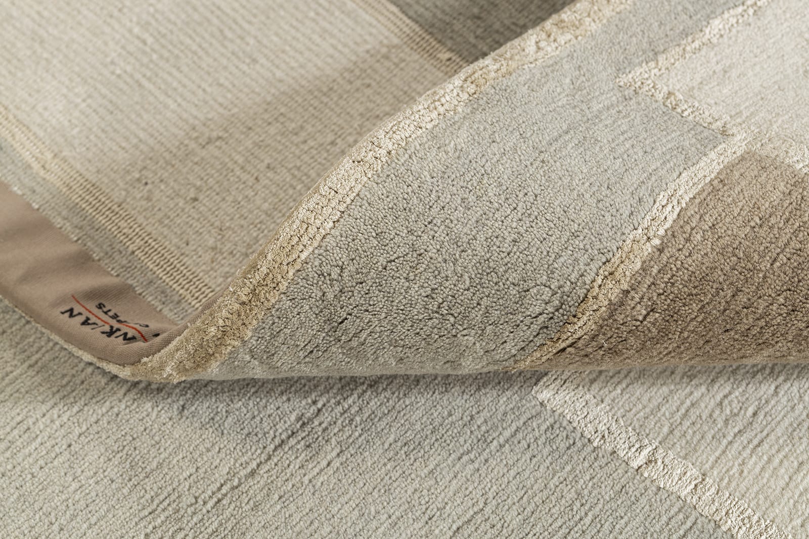 detail image of Knossos II Beige hand knotted area rug design by Tufenkian