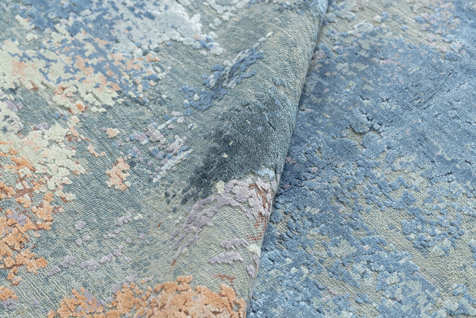 detail image of Niche Blue hand knotted area rug design by Tufenkian