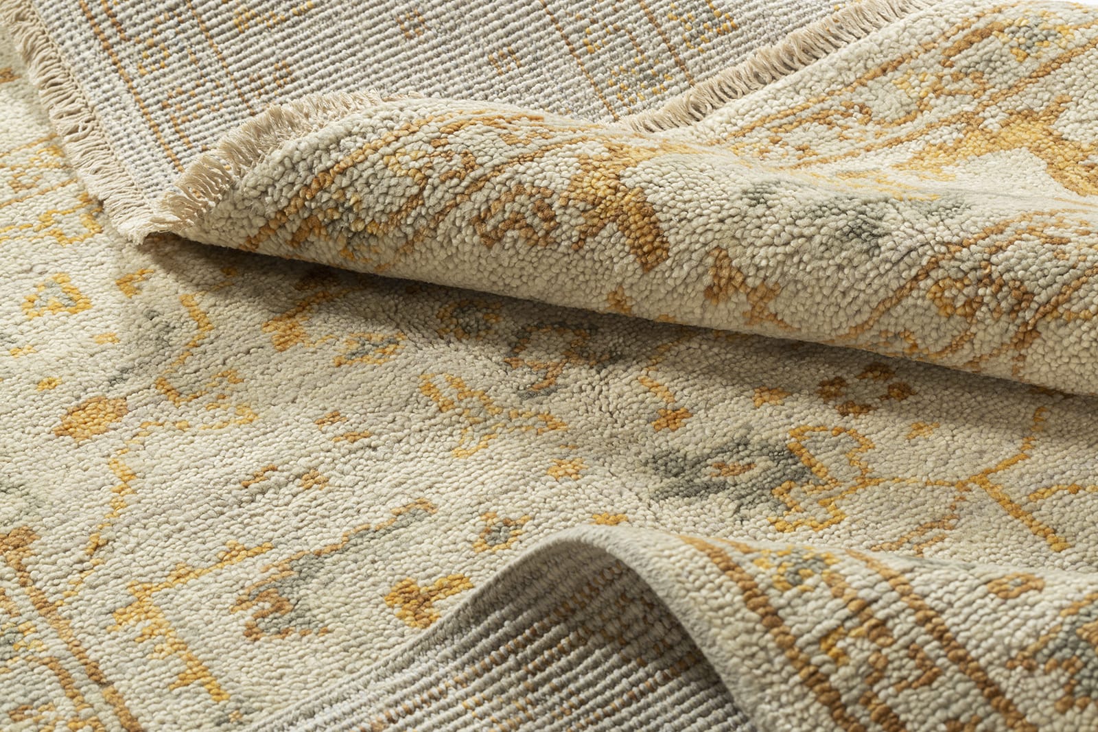 detail image of Tigranakert Ochre hand knotted area rug design by Tufenkian