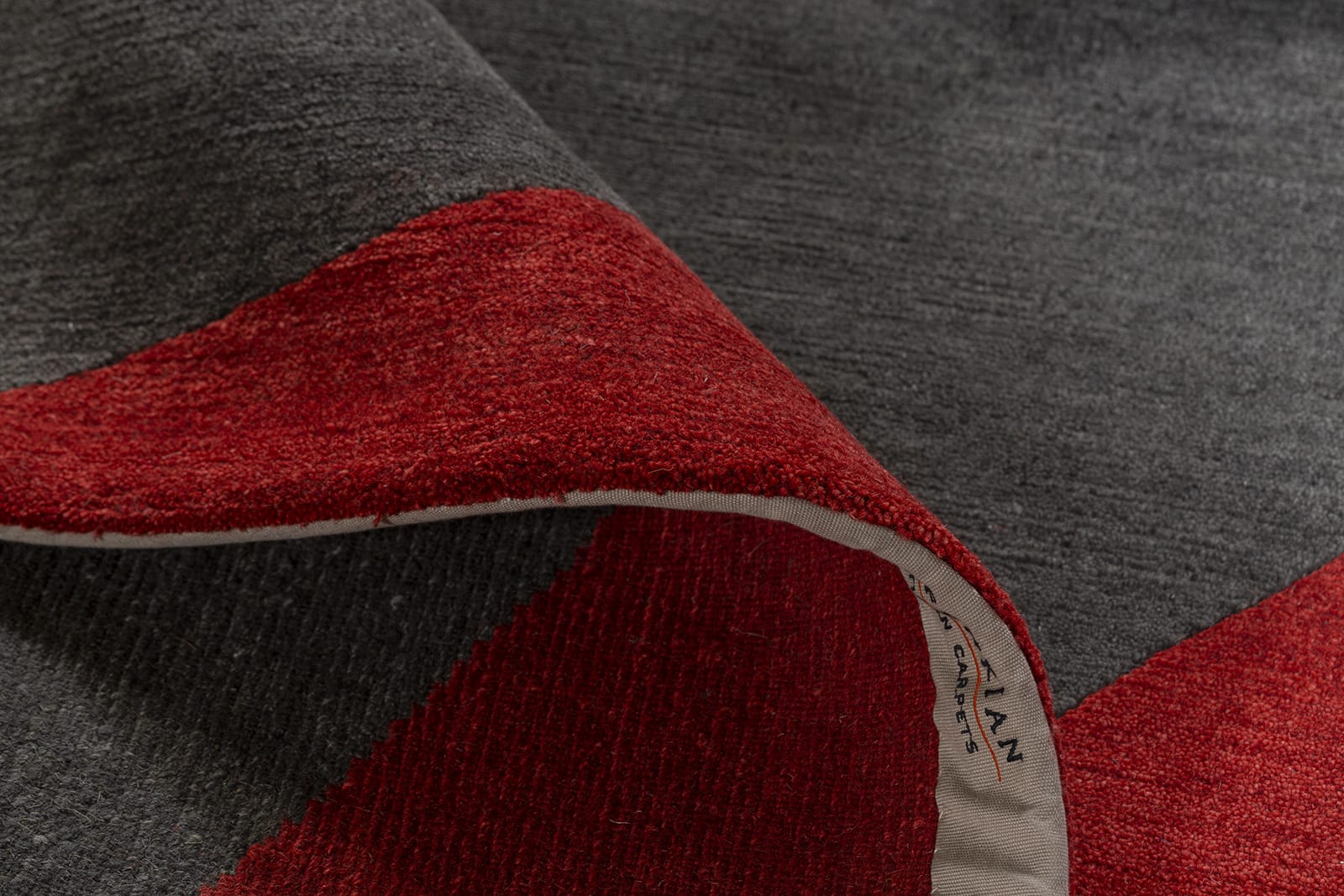 detail image of Turnstile Red Black hand knotted area rug design by Tufenkian