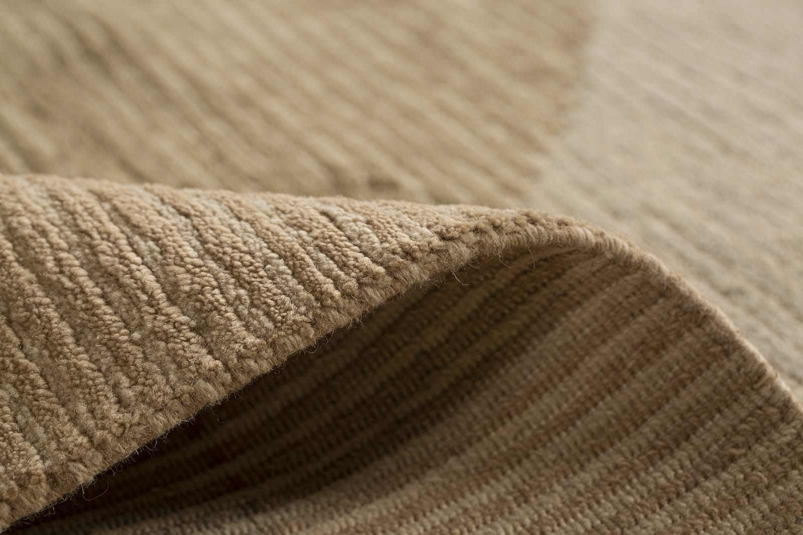 detail image of Cosmos Beige hand knotted area rug design by Tufenkian