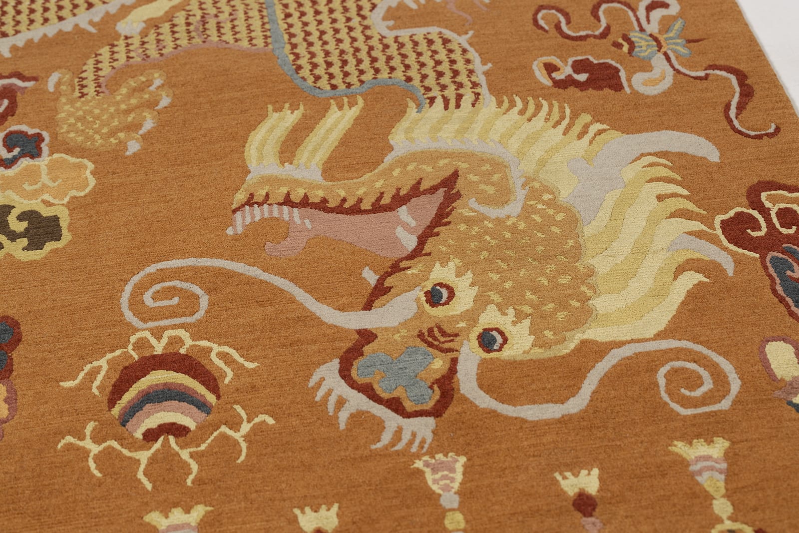 detail image of Imperial Dragon Orange hand knotted area rug design by Tufenkian