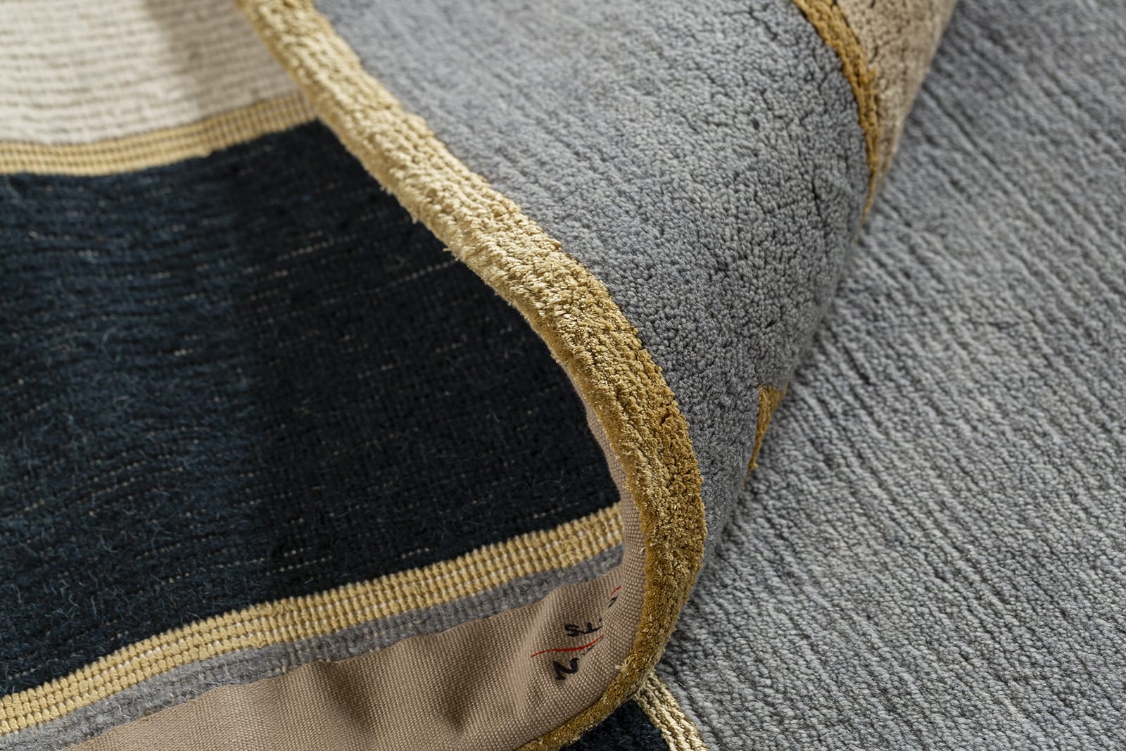 detail image of Knossos II Gold hand knotted area rug design by Tufenkian