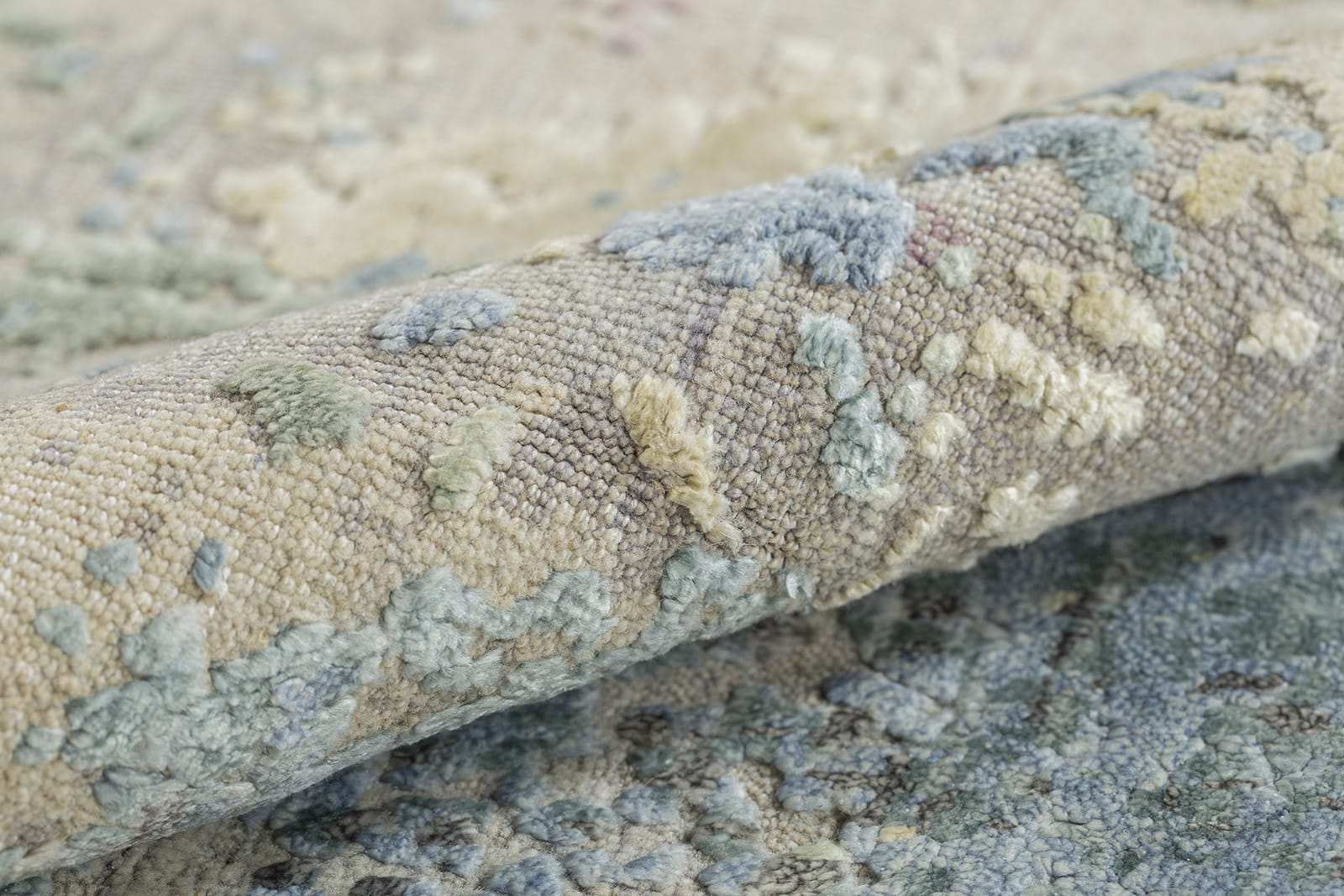 detail image of Niche Pastel hand knotted area rug design by Tufenkian