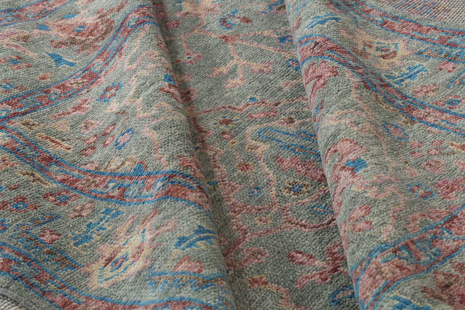 detail of Tigranakert Dusty Rose hand knotted area rug