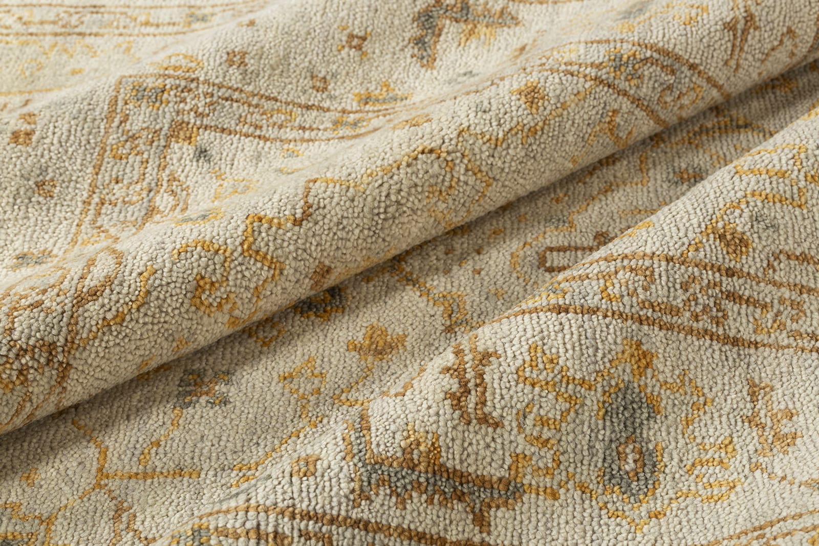 detail image of Tigranakert Ochre hand knotted area rug design by Tufenkian