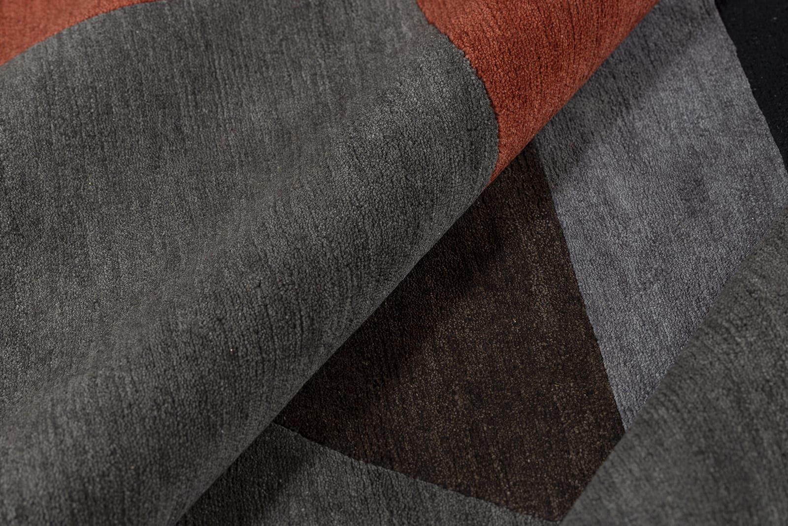 detail image of Turnstile Red Black hand knotted area rug design by Tufenkian